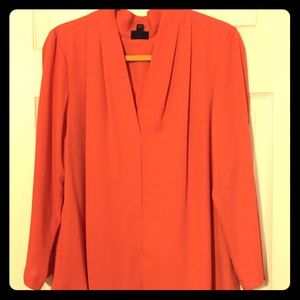 Long-sleeved casual v-neck top in vibrant coral